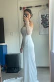 I love love love this dress!! I ordered three different styles of dress in small and extra small sizes. The small size fits me well. The fabric of the dress is so soft, but it definitely needs to be dry-cleaned or ironed, which is not an issue for me. The arm parts might be tight when you try to move or raise your arms. The best way to put it on is to put the arm sleeves last after you zip up the back part. I have always wanted to wear a big fluffy wedding gown, but this was the most flattering line on my body type. I recommend trying different styles because you never know! I can't wait to wear this on the day!!!! - Jeemin J.