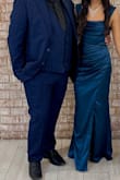 Although it was a little tight, it fit like a gem. The color is beautiful and totally worth it for a fancy party. The only alterations I had to do were length-wise wise and I did ask for them to close it up on the leg because it is super high-up cut. Other than that, the perfect dress. - Estrella F.