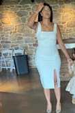 Dress is perfect, tight and holds you in. Thick material, I am 5'5 150lbs. It was pretty richer for me but definitely sucked me in I needed. I should have gone medium for comfort. Overall great dress. - Vanessa H.