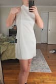 I got the large and I think it's a great dress. I'm going to have it steamed and tailored so the chesst is raised up a bit (like in the second pic) i want the front darts to line up with the top of my boobs and that's a easy fix. Its double lined and the fabric feels really nice. Remember, going to a tailor isn't that expensive when the result is a perfectly fitted dress. So if you're nervous about the fit, size up and just take it to a tailor. I promise it's easy and you'll love the dress alot more than buying a more expensive dress that still isn't tailored to your body and may not fit right. - Rilyn A.