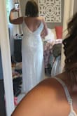I was really impressed with the overall quality of the dress considering the affordable price. 
A few things about myself: 34D, 170#, I do have a belly at my current state. The large zipped up comfortably but top part is really baggy and I will have to make alterations in that area (I also didn't have a bra on so that would change things). I ordered a medium to see the difference and the medium is SIGNIFICANTLY smaller than the large. I couldn't even get it over my hips, let alone zip it up. It felt more like a small but either way, I'd size up if you have a physique similar to me. After adjustments, this dress will work perfectly for my beach wedding. It has some weight but I don't think I'll be uncomfortable in this dress with hot/humid weather that I will be in. The straps will have to be reinforced as other reviewers have said. I do love the overall style and it's exactly what I was looking for. The beadwork is impressive. I did notice a few sequins had fallen off as I was changing though. - Megan W.