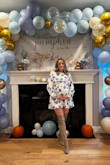 I actually ordered two sizes and kept the large.  I was 27 weeks pregnant on Oct 5th and wore this for my baby shower.  The Medium was too short in the front for my pregnant belly so I went with a large.  Loved this dress.  Got lots of compliments.  Wore it with over the knee boots. - Janelle G.