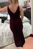 This dress is a gorgeous rich color (true to pictures depending on lighting). The neckline is low but not excessively the way some Lulus dresses tend to be. Straps are thick enough to feel supportive. This dress is very flattering and hugs curves really nicely. It's stretchy and comfortable. I decided it was a little too form fitting/sexy to be appropriate for the occasion for me, but it does create a beautiful silhouette. I thought about sizing up but I think it would be too loose in the bust. I wear a 34DD and the small could accommodate a significantly bigger bust so medium wouldn't work. Something to keep in mind if you have a smaller bust line :) - Annika S.