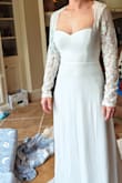 I bought this dress as a backup dress for my wedding. I ended up returning because I chose another dress from Lulus for my wedding day. The quality of this dress was amazing. Great materials and well made. I did find this dress to be a bit large on me. The chest area was somewhat loose and the sleeves were not snug on my arms. I ordered a size small but an xs would probably work better. - Holly S.
