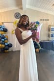 I bought this dress for my bridal shower. I had it hemmed and had the slit closed a little. Then it was perfect. I got so many compliments. The bows were my favorite part. Sooooo pretty. If my wedding was a more casual vibe, it could definitely pass for a wedding dress, too! - Kimberly C.
