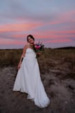 I had a last minute dress mishap and had to order a wedding dress 10 days before my wedding. I absolutely LOVED this dress. So comfy, so well fitted. Simple and classy with some beautiful details in the back. So so so happy with my purchase and thankful! Had to get it hemmed, otherwise fit perfectly. - Stevie S.