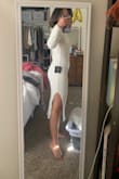 I bought this for my engagement photoshoot at the end of the month. The fabric is thick and nice. The sleeves are too long for me, but it's not a problem. It's a bit long for me, but I'm under 5'. I like it because it accentuates my body shape. I also like the slit on the side. - An D.