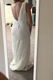 I was hoping to love this dress, but the plunge is so deep. Might be better on someone with a longer torso. The waist felt fine so I wouldn't go down a size, but my boobs would have fallen out. Don't think it compliments my shoulders either. - Amalie Z.