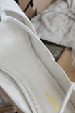These shoes were definitely used and returned. The strap where it's supposed to lace up is broken. Very disappointed - Amanda B.
