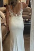 This was a very pretty dress. It was a tiny bit tight on me so I didn't feel like the fabric was very forgiving. I was looking for a dress with some kind of beading or sequins so I didn't pick this one for my wedding. Overall, it is a beautiful dress though! - Tiffany C.