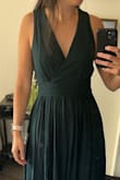 I initially got the Medium and then returned it to get the Small instead, and that's why I rated it as "runs large". I had to shorten it to match my height of course :) I really liked how it fit, very flattering and comfortable. - Maria B.