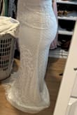 This dress is absolutely stunning. The fit is perfect. It wasn't the vibe I wanted for my beach vow renewal, but the beading is gorgeous and the train is beautiful! It looks so expensive! - Dina S.