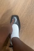 So I'm a size 7.5 in shoes. Since there are only whole sizes, I was advised to size up to an 8 by one of the consultants. It is no big deal because I was assured I could return it worst case. That is sadly what I have to do. These look so cute but they are way too big for me! I do not want any blisters so I gotta send them back. I tried them on so anyone else that's in between sizes can get a feel. Where my finger is is where my big toe is. Please excuse my cat - Christine N.