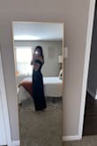 Unfortunately, this dress did nothing for me. It looks like the advertised color in person but does not when I tried to take photos. The slit is not as prominent as it's advertised in the picture. This just looked like a straight velvet dress on me. - Brianna R.