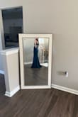 This dress looks exactly as shown. It has a bit of a train in the back. - Brianna R.