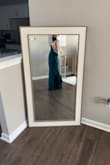 This dress looks exactly as shown and is beautiful. Love the high neckline and the party in the back with the bow! - Brianna R.