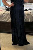 Dress was beautiful and great quality. It was waaay too long for me. 5'7 and even with heels, it dragged the ground. I didn't have to get it hemmed, but it also snugged my poochy area too tightly and did not fit flattering at all. Good luck! - Kelli S.