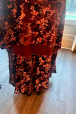 I wore this to a fall wedding. I got so many compliments. It fit my body beautifully, and it was very comfortable! However, the straps did not last long. I barely danced and one snapped (thank goodness for safety pins) and the other was close to snapping by the end. Also, my friend had to tell me at the wedding that one of the back ruffle panels didn't come down long enough and you could see the fabric underneath. Very frustrating! - Katie G.