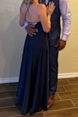 I wore this dress as a guest at a wedding, and I loved it! It fits true to size, but it is very long, so you will need to wear it with heels. I felt very confident wearing it, and I received so many compliments on it! - Paola E.