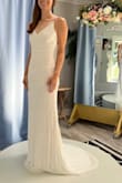 I got this as a back up dress for my wedding reception. It was a last minute Hail Mary as I had major fit issues with my dress. This fit perfectly, outside of being a little long. It was easily hemmed and put a bustle in it. Very flattering, love the beading pattern. - Katelan A.