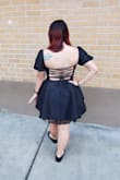 Wore this dress to a goth/all black formal wedding and received a ton of compliments! The dress felt a little risky at first, but it actually poofs out into a perfect length.I was also able to wear without a bra and have good support. The bust of the dress is well fitting cups. I have larger hips and thighs, so the way the dress flows out worked very well. The material is somehow stretchy and I was comfortable even after a big dinner. Taking one star off because the material is extremely high maintenance and hard to iron. Dress arrived extremely wrinkled and it took a while to smooth it out while still delicately ironing. But otherwise, I loved this dress! - Miriam B.