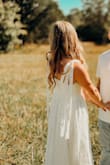 At first I bought it for my super small simple wedding, but once I got it I realized that it was very simple, a little too simple, so instead of it being my wedding dress I used it for my engagement photos. It's a lovely dress and I loved the protective bag that it came with and the special gift (grubhub or hellofresh coupon, i can't remember and 30% off my next order within 30 days, something like that) but it had no form or shape to it, it gave me zero figure, the slit was big but not very noticeable because just standing you can't even tell there is a slit and the bows on the shoulder were a little difficult and i worried that it looked a little awkward. All this said, it was still a beautiful dress and the engagement pictures speak for themselves i think. - Cassidy W.