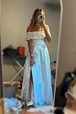 I purchased this dress as a potential option for my engagement photos. While it has a romantic design, the off-the-shoulder fit didn't work for me. It felt a bit tight, and the little belt didn't have the structure I expected, tending to droop and take away from the overall look. Ultimately, it didn't quite fit the vibe I was going for, so I decided to return it. The return process was straightforward; however, it's worth noting that Lulus charges a $2 restocking fee per item, and they also deduct $7 for return shipping. So if you're considering a return keep these fees in mind. - Stephanie H.