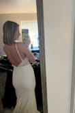 I love this dress but wish there was just a few changes! I love the combination of crepe and lace, and I love how the top still looks tasteful even though it's quite transparent. I love how the detailing looks like vines! The back is also at a perfect depth that's not too low but still fun. 
One of the main reasons I am choosing a dress from LuLus is because of the low price point, and I want to avoid having to get a dress I would need many alterations on. I think this dress is gorgeous and the most unique out of all the ones I've tried on, but I know I'd need to get it hemmed and probably something done about the zipper not going up past the crepe material and into the lace top. The XS fit me so perfectly; I don't think I'd be happy with a S. I would still recommend this dress to anyone who wanted an ethereal almost fairy-like touch to their gown, but something more form fitting than fluffed out! - Wesley Y.