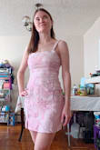 I bought this dress to create a Romy and Michelle High School Reunion costume for Halloween. It's very cute, but it runs very small. I ordered an XS and it fit fine everywhere but the top half. I ordered a blue dress from Lulu's for the other costume, and the XS was a bit too large in the top. I had to wear a very thin bra, otherwise, the top on this pink dress would not have fit at all.
Also, the zipper is low quality on this dress as well as the blue one They both were difficult to zip above the seam in the middle. My friend was able to zip it for me by using the hook-and-eye closure, then zipping carefully, then unhooking the hook and eye. This would be impossible to zip without assistance.
It's a very pretty dress. I'll try to wear it another time...as long as I have help to zip it. - Jessica W.