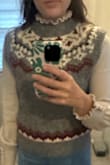 I sometimes wear a small and sometimes a medium. I got a medium and it fits perfectly. Very comfortable and not cropped. I also got the shirt under it in the pictures and love it as well. - Courtney E.