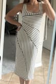 Absolutely love the way this dress fits. Hugs my curves very nicely. Great midi length. Looks just like the pictures. Great for date night for a casual shopping day alike. Thick enough material you can't see through, but won't overheat. Great deal! - Carley J.