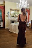 I got many compliments at the black tie fall wedding I wore it to. The color is more burgundy in person IMO. Photographs beautifully as well. Some minor issues: the top straps felt a bit loose at times meanwhile the bottom is a bit restrictive. I did have to make adjustments throughout the evening. It was also a little hot (temps were high 70s/low 80s) and the dress doesn't really allow for any airflow. But I would recommend overall, lovely dress! - Blair S.