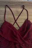 This dress is so pretty, the color is dark and rich and it fit perfectly well. I ordered this to wear at my little brother's wedding. It held up all day; through running around, taking pictures, dinner, etc. But as the reception went on, I felt a snap and realized the strap just... gave out? Thankfully I had a safety pin and my husband was able to safety pin the strap together, but I was so disappointed by the quality. For nearly $100, I expect the straps to hold up for more than just wear and one evening. This is the second formal dress I've ordered from Lulu's that had an issue with quality. :( - Kelsey D.