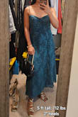 This is a very pretty and also elegant dress. I chose a different dress to wear on the formal wedding I attended but I will keep this one because i can wear it to church or more formal events, it can be very flexible. The only thing I wish it had is a built-in bra like the other dress I chose. It's a little loose on my waist but I prefer it that way, not tight fitting and it's comfortable. My husband loves it, he says it makes me look taller. - Micah O.