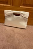 This is absolutely perfect! Have had such a hard time finding a cute, small bag that fits my phone and my wallet, but this bag fits my stuff with room to spare! So excited to use it for an upcoming wedding. It's absolutely adorable and has exceeded expectations! - Rachel G.