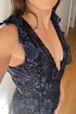Ordered this for a black tie wedding and it was great, the material is nice and the tiers give a nice shape to the bottom. The V was a little too deep- I have a short torso and didn't have fashion tape. I ended up using a safety pin to keep the girls from slipping out. - Jessica J.