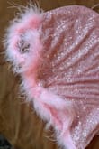 For the price of this dress, it feels like it's from SHEIN. The quality is horrible. The fabric is thin and the fur at the bottom isn't even attached all the way around. Immediate return - Alexis G.