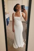 I was looking for a simple, elegant dress in mermaid style, and I found it!
One of my bridesmaids recommended Lulu's for an affordable wedding dress, and I'm glad I checked it out. This dress has comfortable, slightly stretchy fabric. It is a bit loose in the chest for me and a bit tight across the stomach, but I like the way it looks overall, and I'm planning to get the chest taken in if possible. I think a size-up would end up being too big, so I'm sticking with XS.
The garment bag included with the order was a nice touch that I hadn't even thought about needing before.
I'm even more excited for my wedding day now that I found my dress!! Didn't even have to break the bank! - Kayla C.