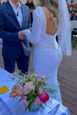 Beautiful gown and very good quality. Many reviews said it runs big so ordered one small and one x-small. Both fit, but the small fit better. The x-small kept falling off the shoulder; the small stayed well. Used clothes tape to make sure. - Val P.