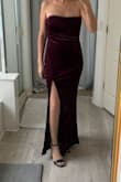I went to a wedding that was themed "Old Hollywood Glam". I loved wearing this dress. It's velvet, strapless and a nice heavy dress. It feels of good quality. The top half was a little big so I had it altered to fit better. I am a 34-36 B, small boobs so I wore a strapless with this even with it altered. The slit down the left side is pretty. I love the fit on me. - Vanessa K.