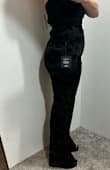 I was very disappointed in the bottom have of this jumpsuit. The top half fit great and is lovely black velour, not velvet. I have a large chest and the top actually fit. The bottom half is this mesh overlay. Not what was expecting at all. It is very snug on my thighs and butt. I don't like the way it feels. I wear a size 6 and thought the Medium would fit great after reading the reviews. Unfortunately, only the top half fit. The waist is a little big so sizing up isn't an option. - Amy M.