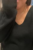 Love this sweater! I'm currently 7 months pregnant and ordered my pre-pregnancy size (XL for 5'10" normally 185 lbs) and it fits comfortably. I will wear this as an everyday oversized sweater after I get back to my normal size. 

This sweater is exactly like photos, slouchy but put together and you can dress it up or down. It's equally cute with tights and a dress as it is with a jumbo t-shirt and gym pants. It's warm enough for Texas cold weather and it's a beautiful year-round layering piece. The fabric is well made, hangs beautifully, and comfortable- especially for someone who is sensitive to itchy fabrics. After several washes it does hold it's shape well (I always lay flat to dry).  You could probably size down and it would still fit well, I do notice with XL the shoulders slip off at times (but I always have a tank underneath and it's cute so I would keep my same size when reordering.)

I am 5'10" usually 185lbs but currently 210 and XL fits very well. Could size down to L and still fit now & later. - Kristen
