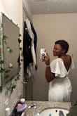 I recently purchased this stunning white dress for my courthouse wedding, and it exceeded all my expectations. The dress had a simple yet elegant design, perfect for the intimate and meaningful setting of the courthouse. The fit was flattering and comfortable, allowing me to feel confident and radiant on my special day. The fabric felt high-quality, and the minimalist details added a timeless charm. It was exactly what I envisioned; chic, classy, and effortlessly beautiful. I couldn't have chosen a better dress for such a memorable occasion! - Jailyn T.