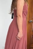 The dress is beautiful. I'm a small size and it was too long for me. It's also a little big in the bust area. I still like the style and the shape. The fabric looks good quality and has several layers. - Victoria L.