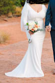 I bought this dress for my elopement in Sedona. The material is good, maybe a little thin, but not see through. I feel like it fit me pretty well. I have a bigger bust and I am definitely bigger than the model. (I made no alterations to this dress). I wore 2 inch heels with it. The only thing I did note was that the buttons down the back are a little flimsy (one of them came off of my dress). For me it was not a big deal. All in all, great value for the dress. - Cynthia M.