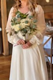 I chose this dress as my wedding dress. It fit me perfectly on the top, I only needed to get it hemmed. I have a small chest and size small fit perfectly. I'm so happy with this dress and it was amazing the whole night. - Abbey R.
