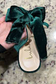 The shoe color is as shown. A little small but manageable. The bow is terribly applied on one of the shoes and not that great on the other. The tails of the bow are uneven and frayed because it was not sewn properly to close. The bow flops down and the loops are uneven in size. The bow is stitched together so it cannot be adjusted. Unfortunately, it's sold out for me so I can't exchange. - Victoria V.