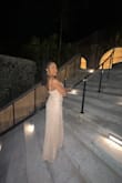 This dress fits true to size and is very beautiful. It was not tight at all and was able to show off my body figure! The material is outstanding and the straps are adjustable which is a big plus for me! I loved the fact that I was able to wear a long dress and show some leg at the same time. I would recommend this dress 100% and will be purchasing from Lulus for all my holiday events going forward! Ahhhhh - Adrayanna B.