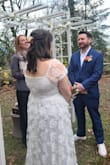 I loved this dress so much and I was so surprised when it came and it fit perfectly right away!! I wasn't expecting to be able to just fit into it and not need any alterations at all. I wore this dress for my wedding in November, which was just a small little park wedding with our immediate family only, and the dress was perfect for that occasion. Not too fancy, not too casual, just right. I loved how the sweetheart top was sexy, but not too revealing and the midi length was ideal for showing off my custom Converse. The only tiny adjustment I made is that I used boob tape to make sure the top stayed flush to my chest and didn't have too much of a gap. Since I have larger breasts, I didn't want to be flashing everyone at my wedding. But other than that, the rest fit like a glove and was super comfortable to wear. I loved the flower applique and got so many compliments on it as well. Would definitely recommend!! - Ashley R.