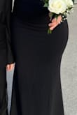 It fits well, like a glove, but you do need to wear heels if you are 5'3". The material is stretchy, so keep that in mind when ordering; you may need to order a size smaller. I ordered a Small and a Medium and ended up wearing the Small. - Ingrid M.